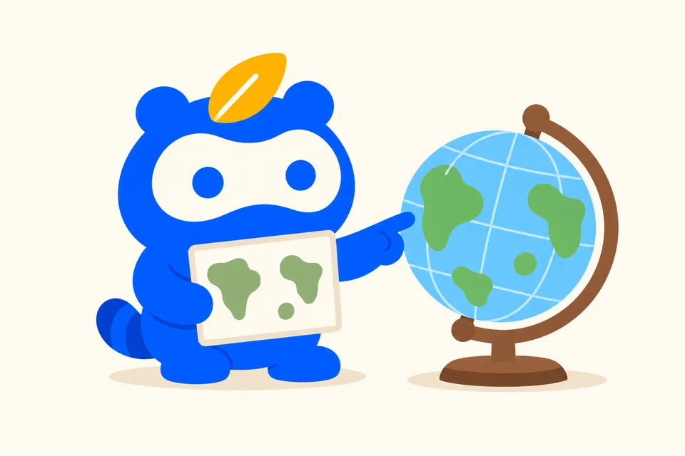地球儀と無地の地図カードを見比べるソクポンのマスコット。