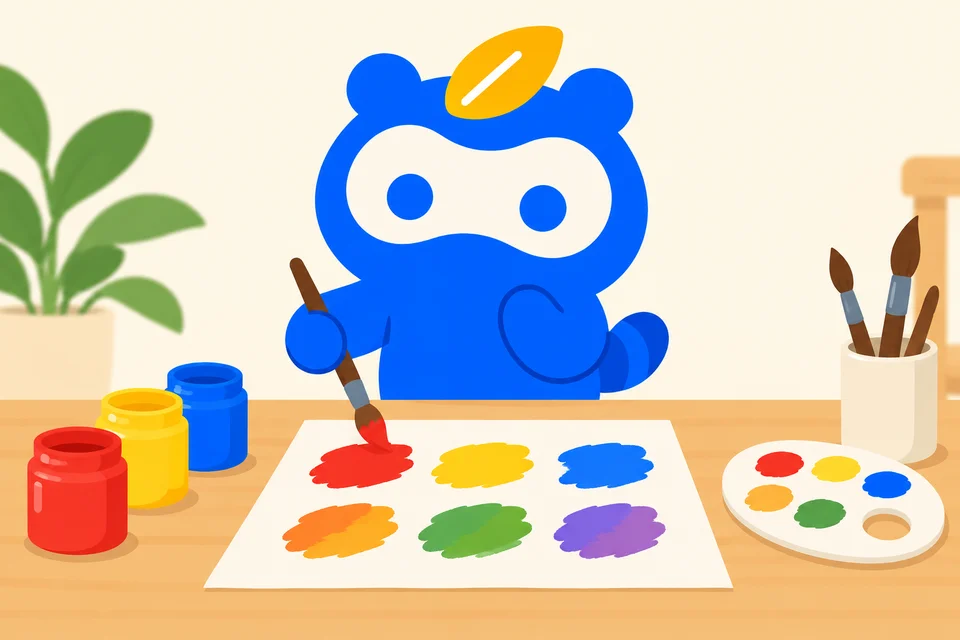 赤・黄・青の絵の具と混ぜた色の試し塗りを見比べるソクポンのマスコット。