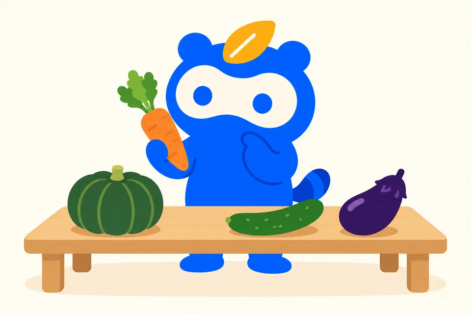 にんじんを持ち、机の野菜を比べるソクポンのマスコット。
